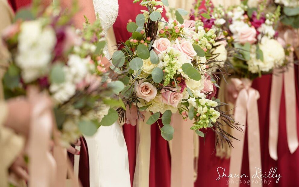 a group of women holding flowers