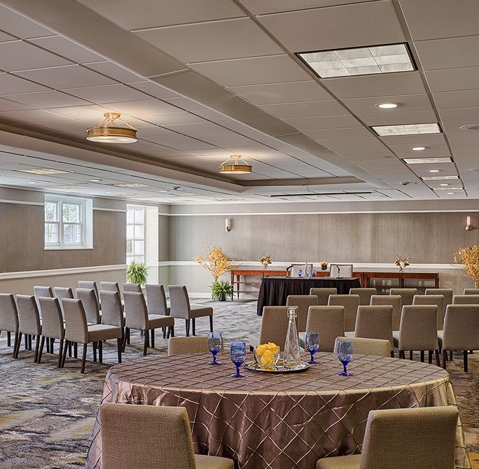 a large meeting room set up for a discussion panel