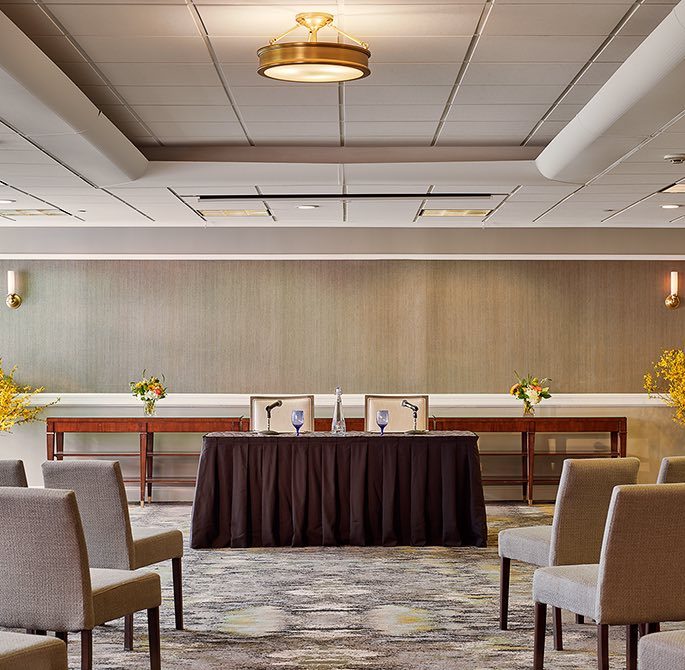 a meeting room set up for a discussion panel