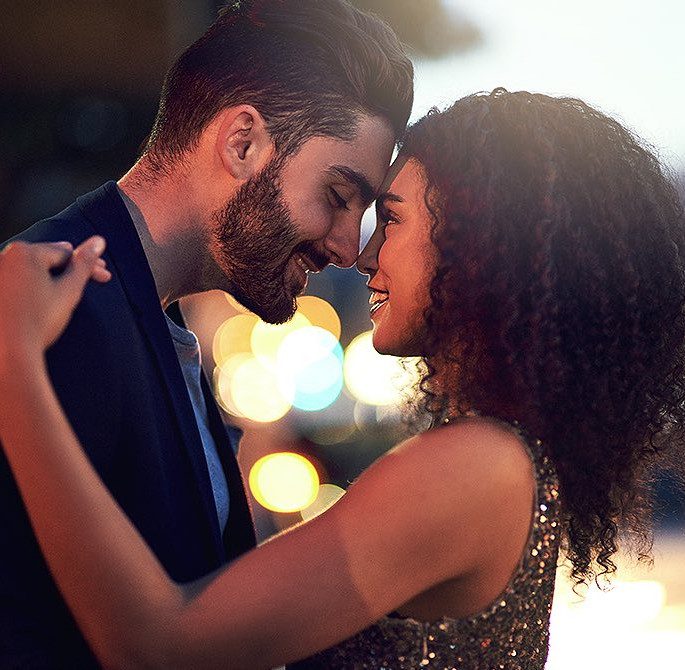 Man and Woman embracing and looking at each other
